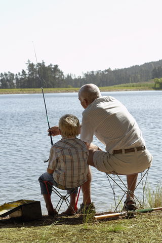 http://www.dreamstime.com/stock-image-grandfather-grandson-fishing-lake-rear-view-image33895241